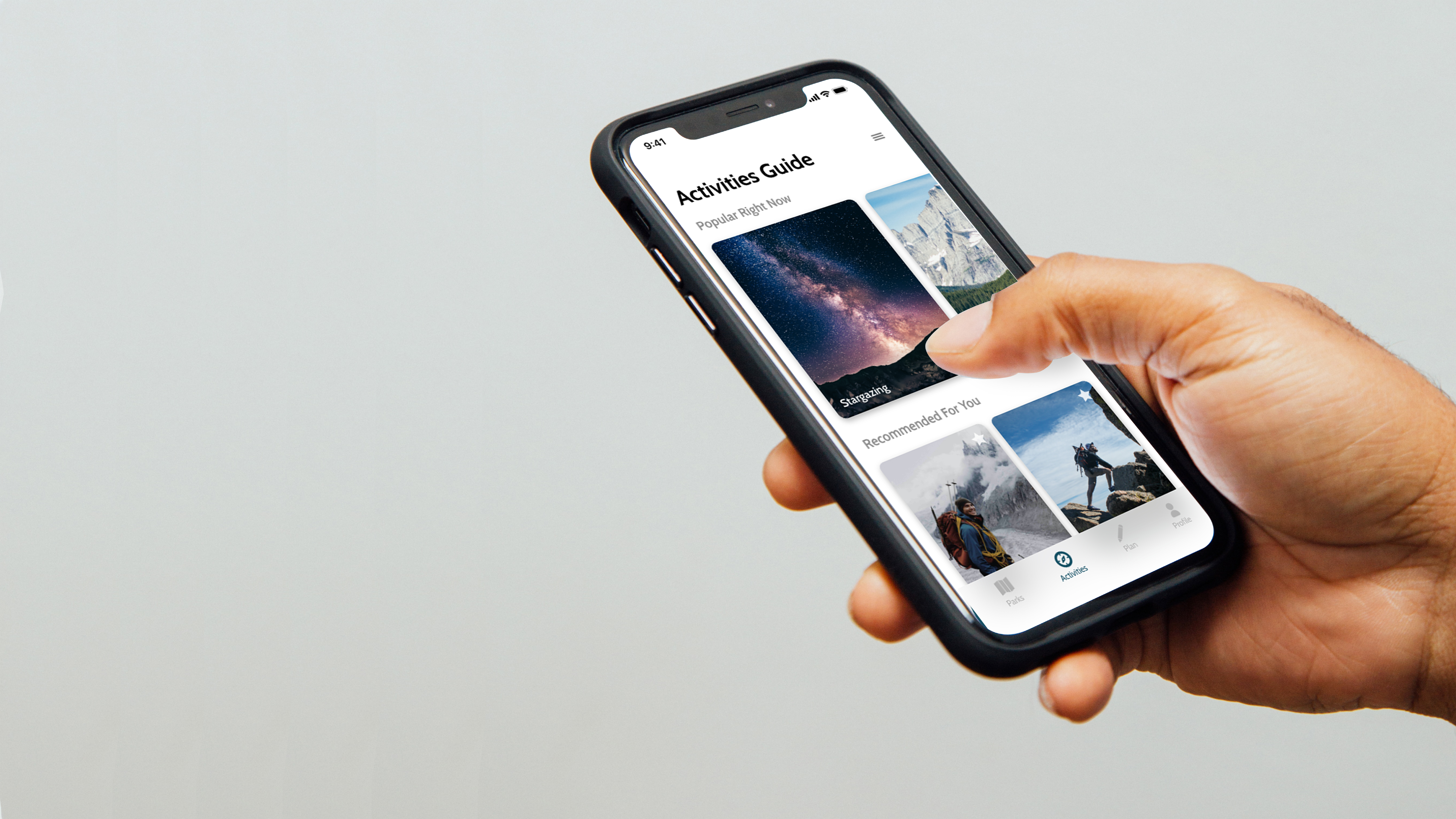 hand holding a phone showing the activities guide page
